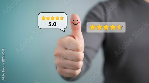 Business professional giving five-star rating with thumbs up gesture for customer satisfaction and quality service