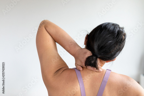 Woman experiencing neck pain relief.