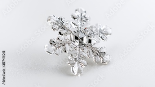 A detailed crystal snowflake ornament, showcasing intricate facets and a delicate structure against a clean background