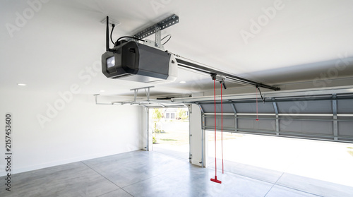 Professional installation of a smart garage door opener in a clean, modern home.