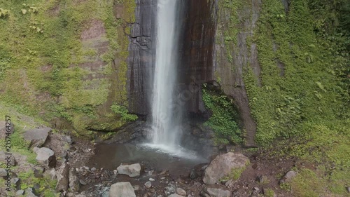 Spectacular Cascading Waterfall Surrounded by Lush Greenery in a Serene Natural Setting