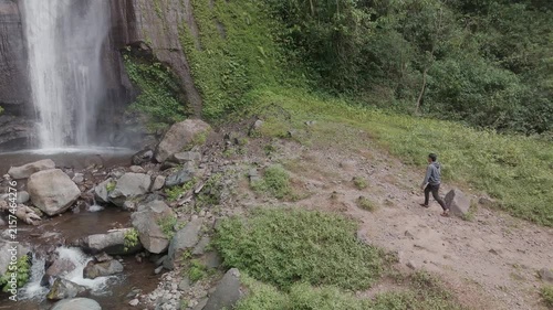A Serene Waterfall Adventure: Exploring Nature's Beauty in Lush Greenery and Flowing Water