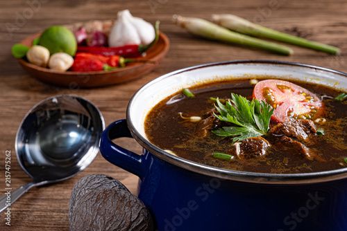 Canvastavla Close up of authentic rawon east javanese dark beef soup with keluak nuts and he