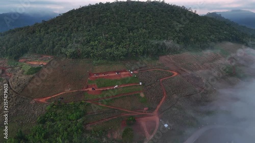 An aerial video showing misty mountains in the morning as the sun rises.