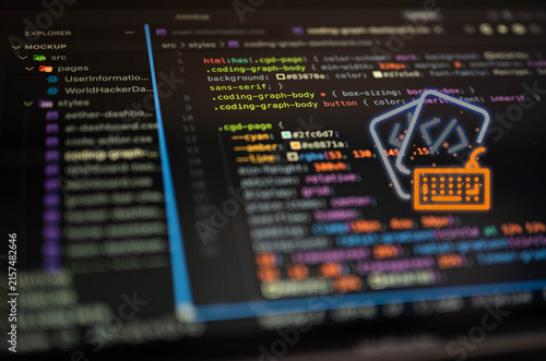 Software development concept with source code and coding keyboard icon on screen, representing programming, web development, coding, software engineering and modern digital technology workflow.
