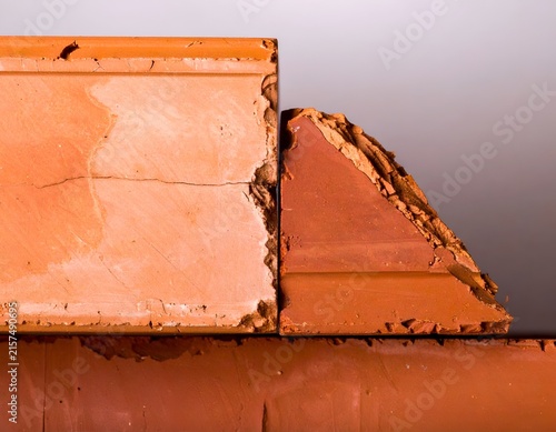 Macro shot of a broken terracotta brick edge.