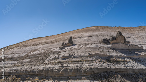 Canvastavla On the vegetation-free mountainside there are bizarre rock formations in the form of smurf houses with sharp conical roofs