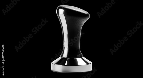Modern black wooden coffee tamper with shiny chrome base and handle for espresso.