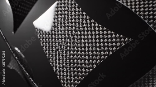 Abstract dark background with a detailed carbon fiber texture pattern