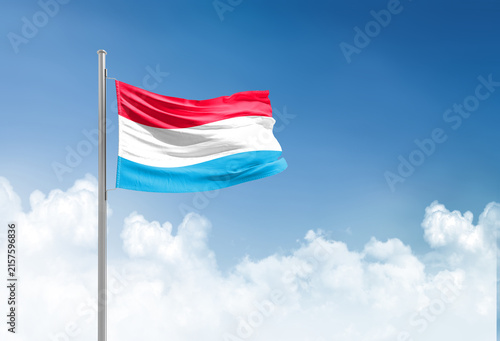 Quadro su tela Luxembourg flag waving in beautiful sky.