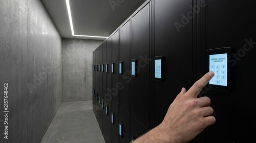 Finger pressing digital keypad showing access granted on modern locker system