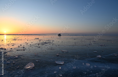 Fotografie A hovercraft on Lake Baikal in the early winter morning