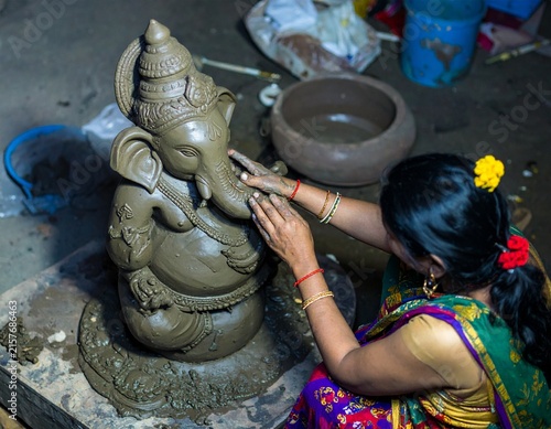 Heritage workshop in Maharashtra where an artisan carefully crafts traditional objects, revealing authentic tools, materials, textures, and everyday work.