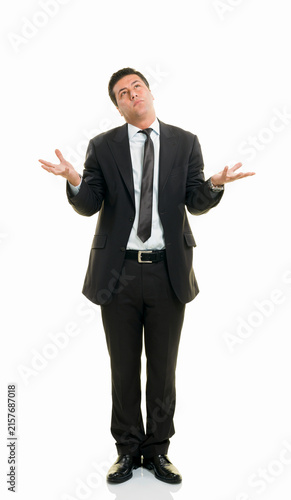 Foto Confused Businessman Shrugging Shoulders and Holding Open Palms Out Isolated on