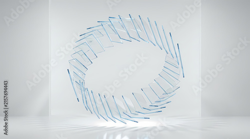 A circular arrangement of glass panels forms a geometric ring in a bright room.