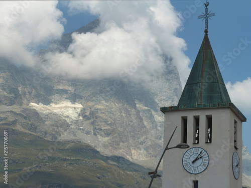 church tower  and mount cervino in the mountains in cervinia village italy