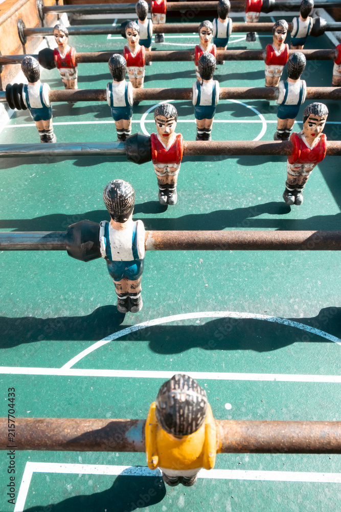 Fototapeta premium Vintage table soccer players on green field The Concept of competition and nostagia