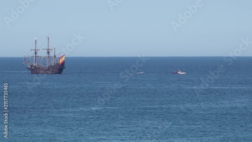 Historic Galleon with Spanish flag sailing close to the coast of Ireland in County Donegal