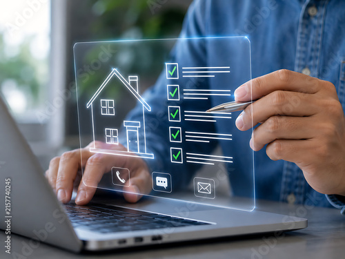 Real estate checklist with house outline displayed on a transparent screen with a laptop