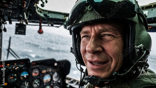 Coast guard rescue pilot in helicopter cockpit