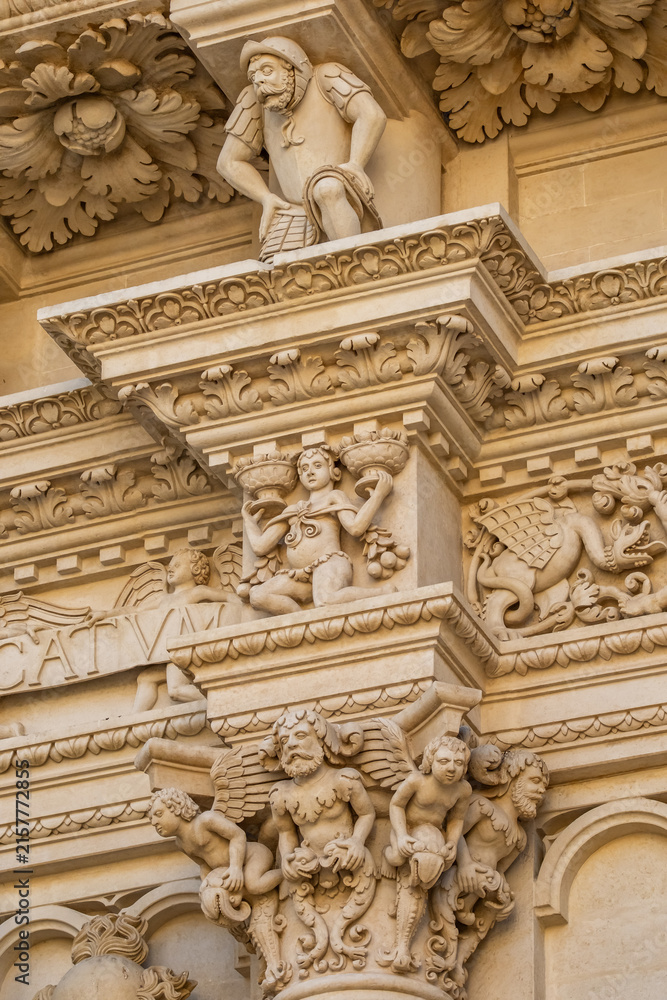 Fototapeta premium Detailed Baroque stone carvings on Basilica di Santa Croce facade in Lecce, Italy