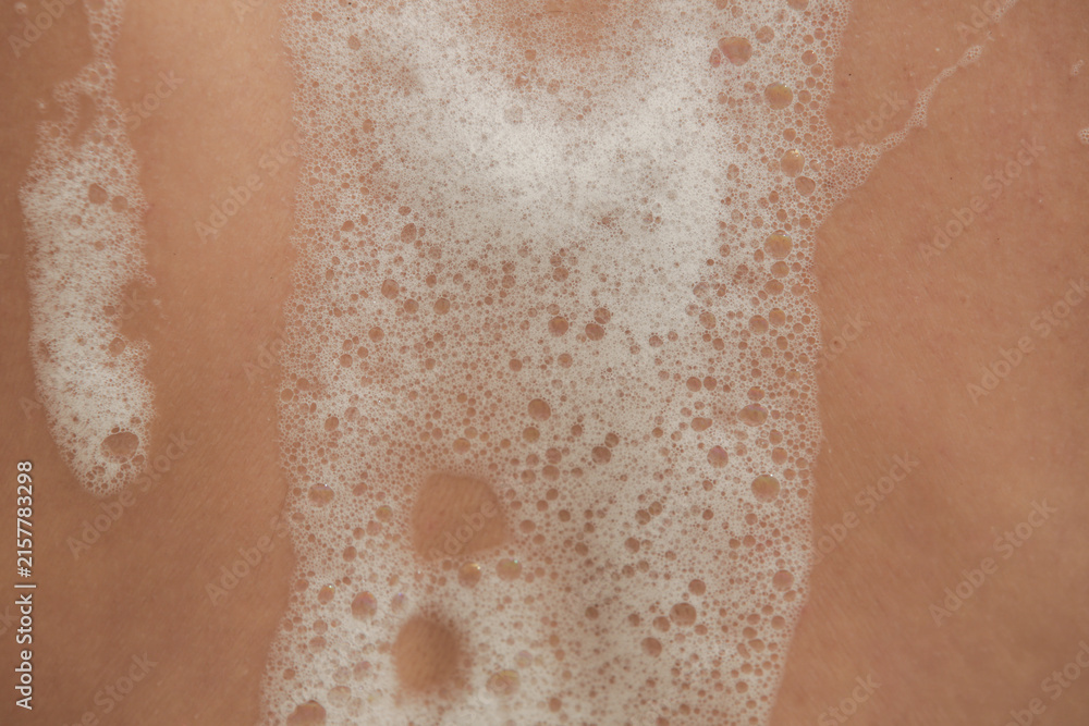 Fototapeta premium Close Up of Bath Foam on Skin During Bathing