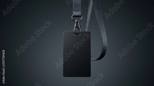 Blank black rectangular ID card or employee badge mockup hanging vertically on a dark grey background with a matching black lanyard and metal clip, ready for corporate identity or event access customi