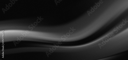 Konstfotografi Smooth black fabric flowing with subtle light highlights creating a luxurious ab