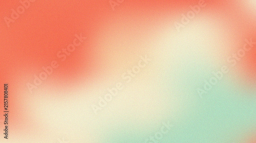 Abstract soft gradient background with grainy texture in coral and mint green colors.