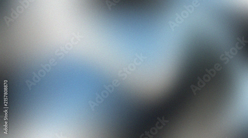 Abstract blue and grey gradient background with soft grainy texture and blurred light effect