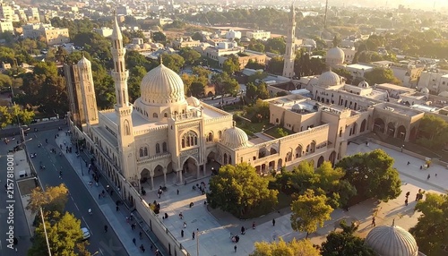 Majestic Mosque with Dome Minarets in Urban Setting at Sunset