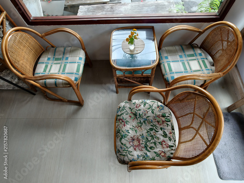 Interior vintage design, Slow lifestyle concept rest room in the coffee cafe design. chair, interior, shop, relax, rattan, wicker, cane, flower, holiday, peace, corner, glass, homespun, simple, arts