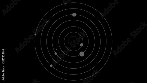 A schematic representation of a solar system with a central dark circle and multiple concentric rings, populated by several grey circles of varying sizes.