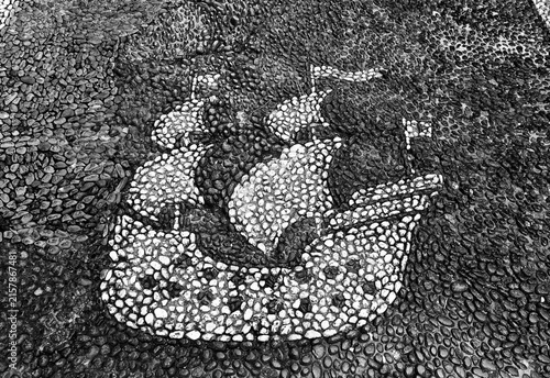 Obraz na płótnie Traditional Ligurian risseu pebble mosaic pavement depicting a historic sailing