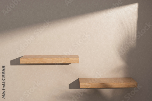 3d render floating wood shelf with Soft Sunlight, abstract White concrete wall with sunlight shadow reflected.