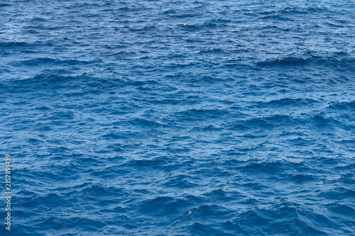 Принти на полотні Vibrant blue waves gently undulating under the warm sun at the serene seaside
