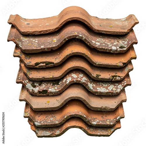 A stack of old and weathered clay roof tiles on a white background