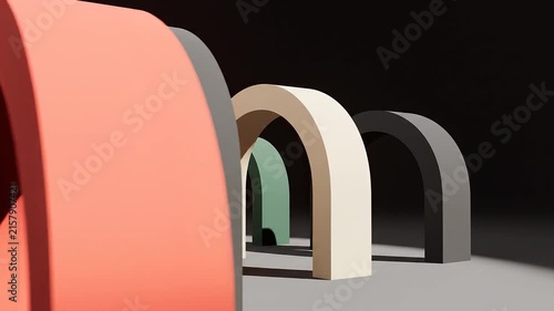 Abstract arch animation featuring colorful geometric shapes moving through a minimalist studio space with dramatic lighting and modern design elements for creative commercial video projects