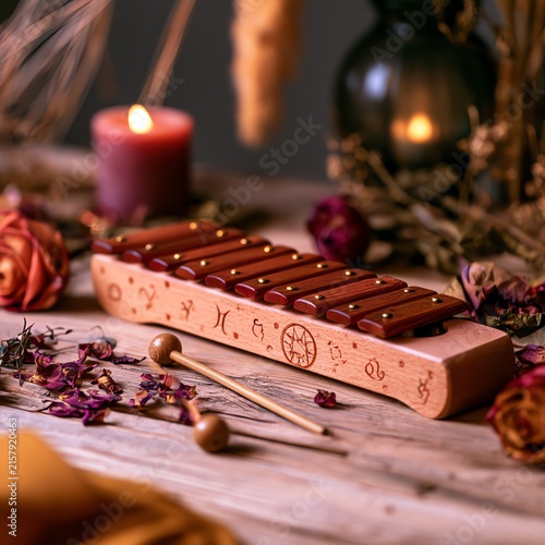 Mystical Still Life of Wooden Xylophone with Lit Candle