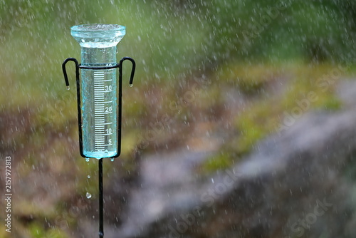 Foto Rain Gauge Measuring Heavy Rainfall in Garden
