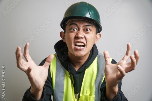 Canvastavla Angry Asian Construction Worker in Hard Hat Expressing Extreme Frustration