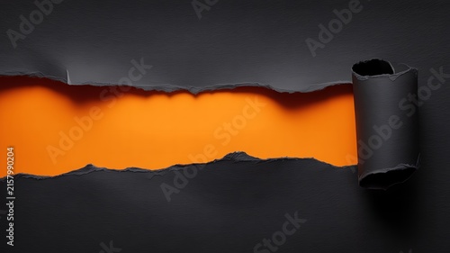 Bright orange background visible through ripped black paper strip roll.