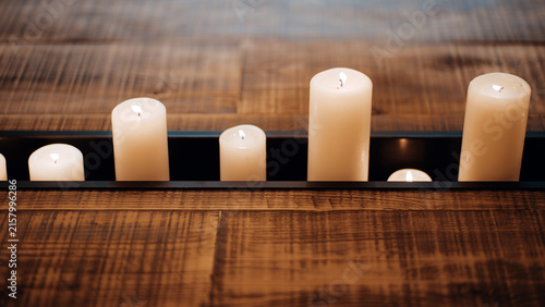 Bild auf Leinwand Distinctive reclaimed wood table features a recessed black metal trough filled w