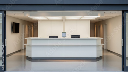 Realistic Modern Clinic Lobby With Minimalist Desk, Wall-mounted Tv, Overhead Lighting, And Clean Neutral Colors, No Peo