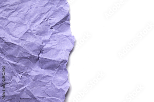 Crumpled purple paper texture background with torn edge
