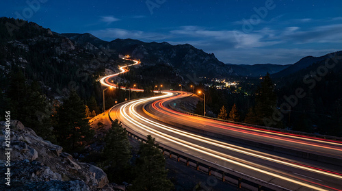 Curving highway with traffic lights at night under starry sky