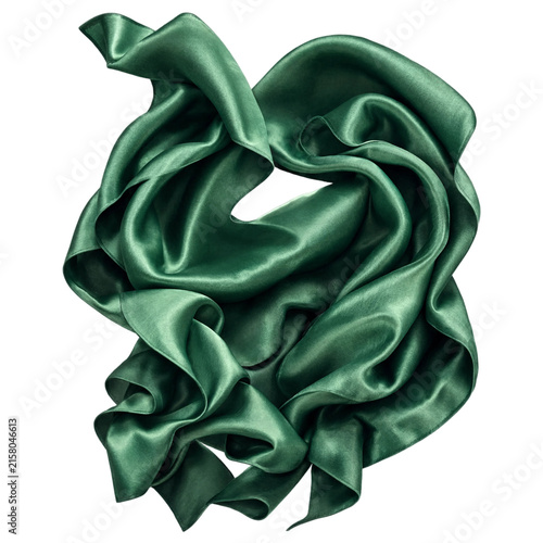 A flowing piece of emerald green silk fabric with soft folds and a glossy sheen, isolated on a solid black background, textile texture