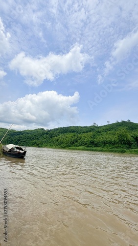 Nature Village Environment Mountains River Traditional Boat. boat on the river