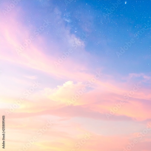 a pink sky with a few stars