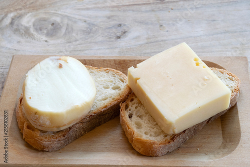 cheese slices on rustic bread tray